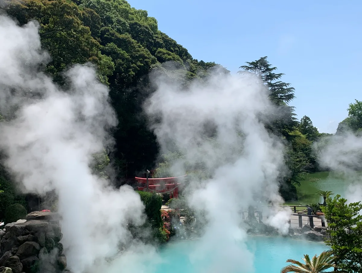 Steam pouring off the cobalt-blue water of Umi Jigoku, the Sea Hell