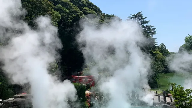 Steam rising from the cobalt-blue Umi Jigoku hot spring